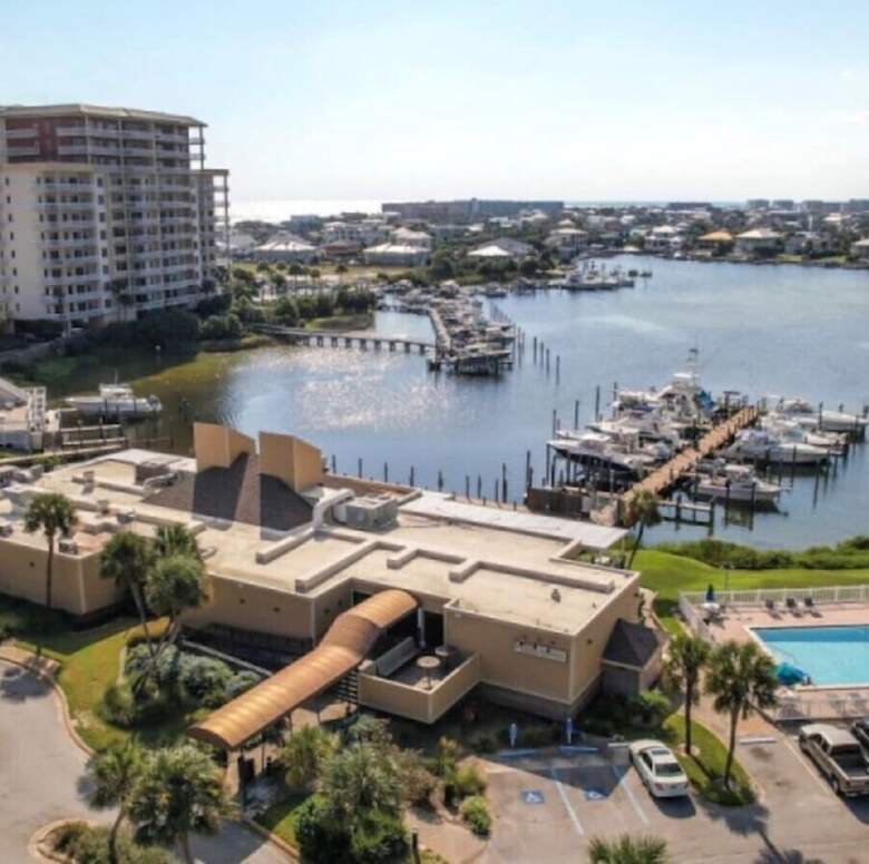 Aerial of the harborside restaurant, pool, and marina at Sandpiper Cove
